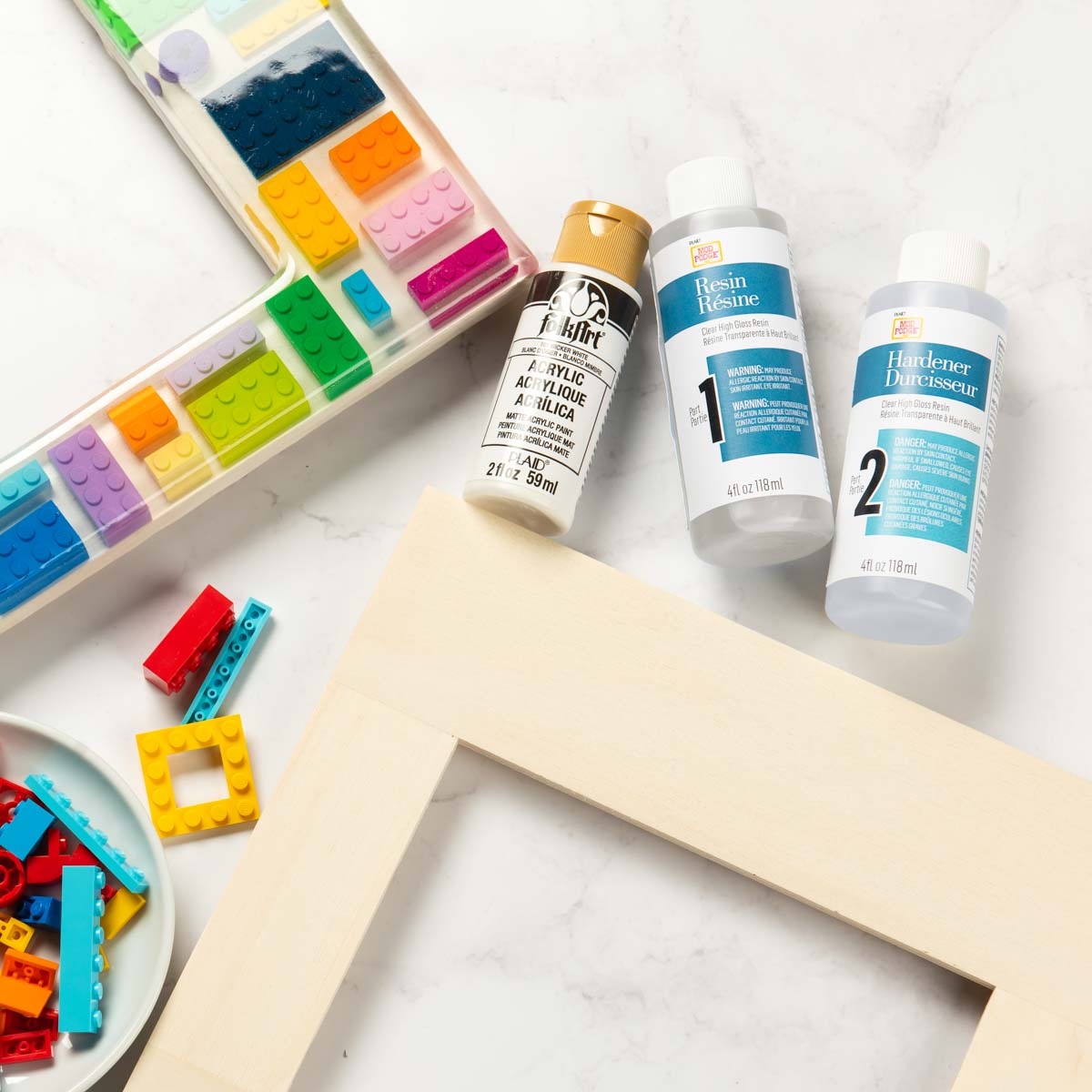 Wood frame with white paint Legos and resin