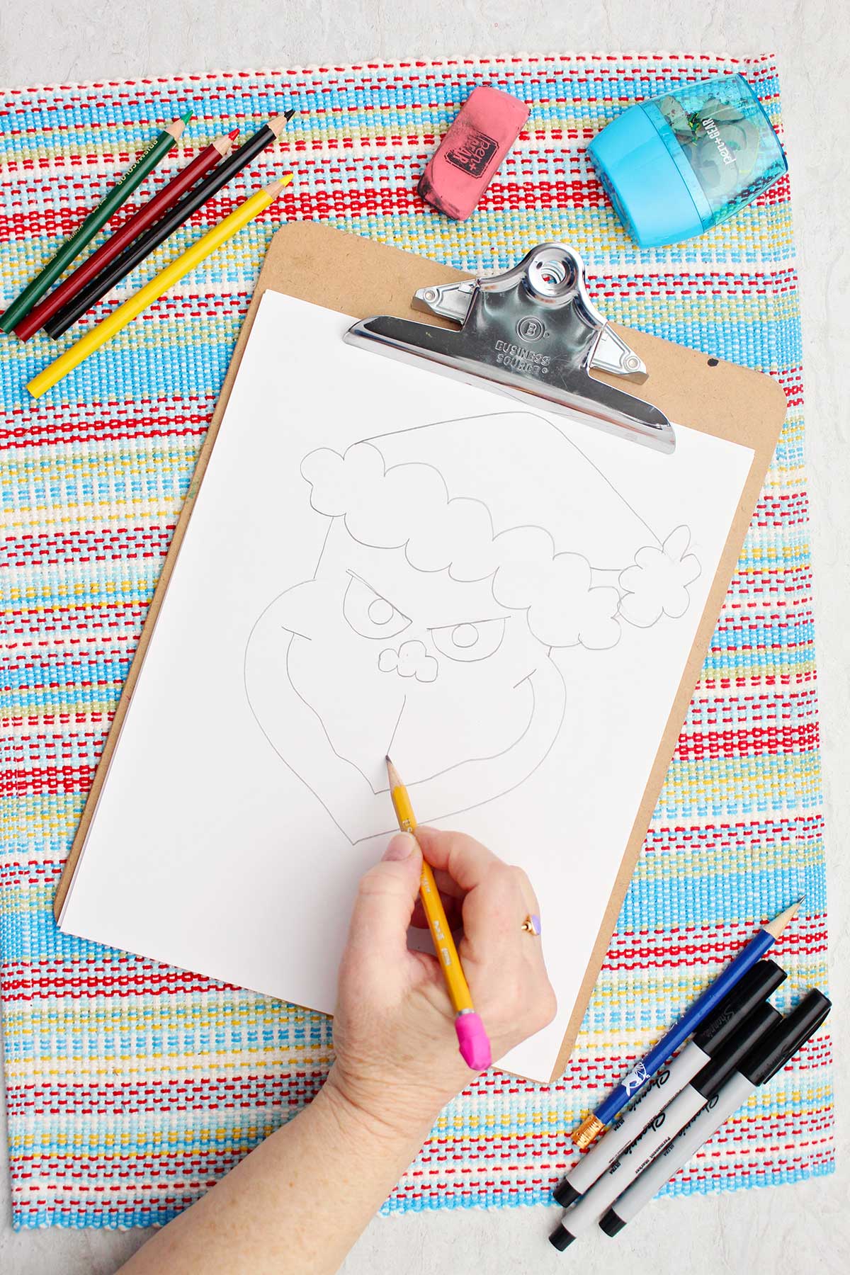 Person doing some facial details on their Grinch sketch.