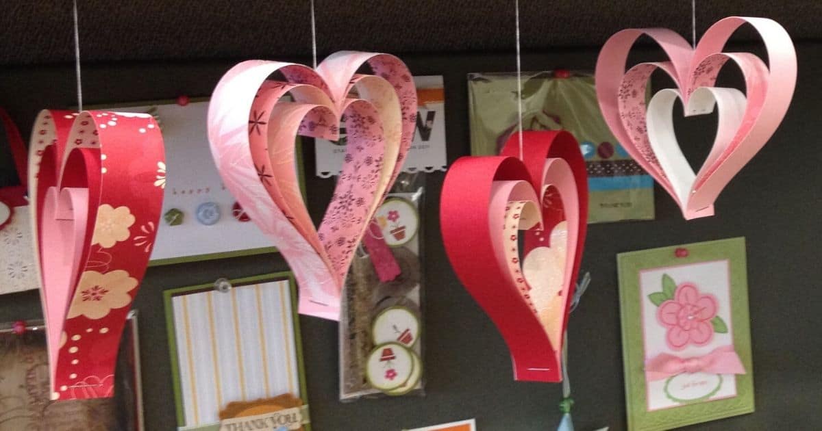 Four hanging paper strip hearts.