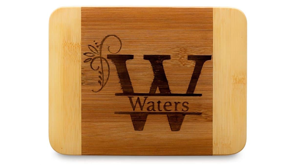 Personalized bamboo cutting board with the W monogram and the last name Waters.