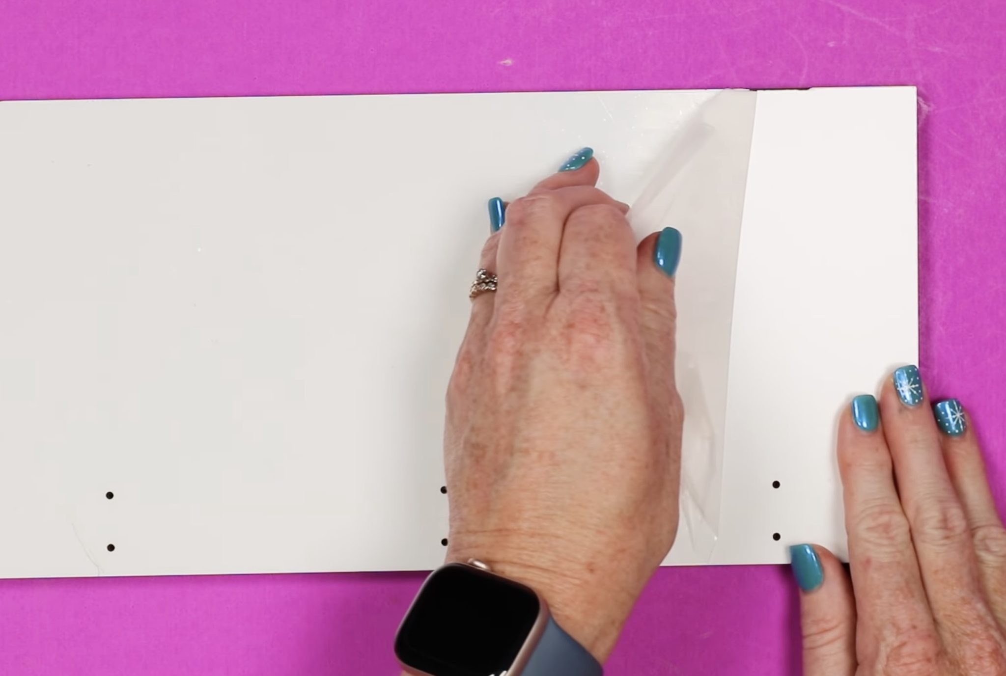 Remove protective film from sublimation hanging organizer.