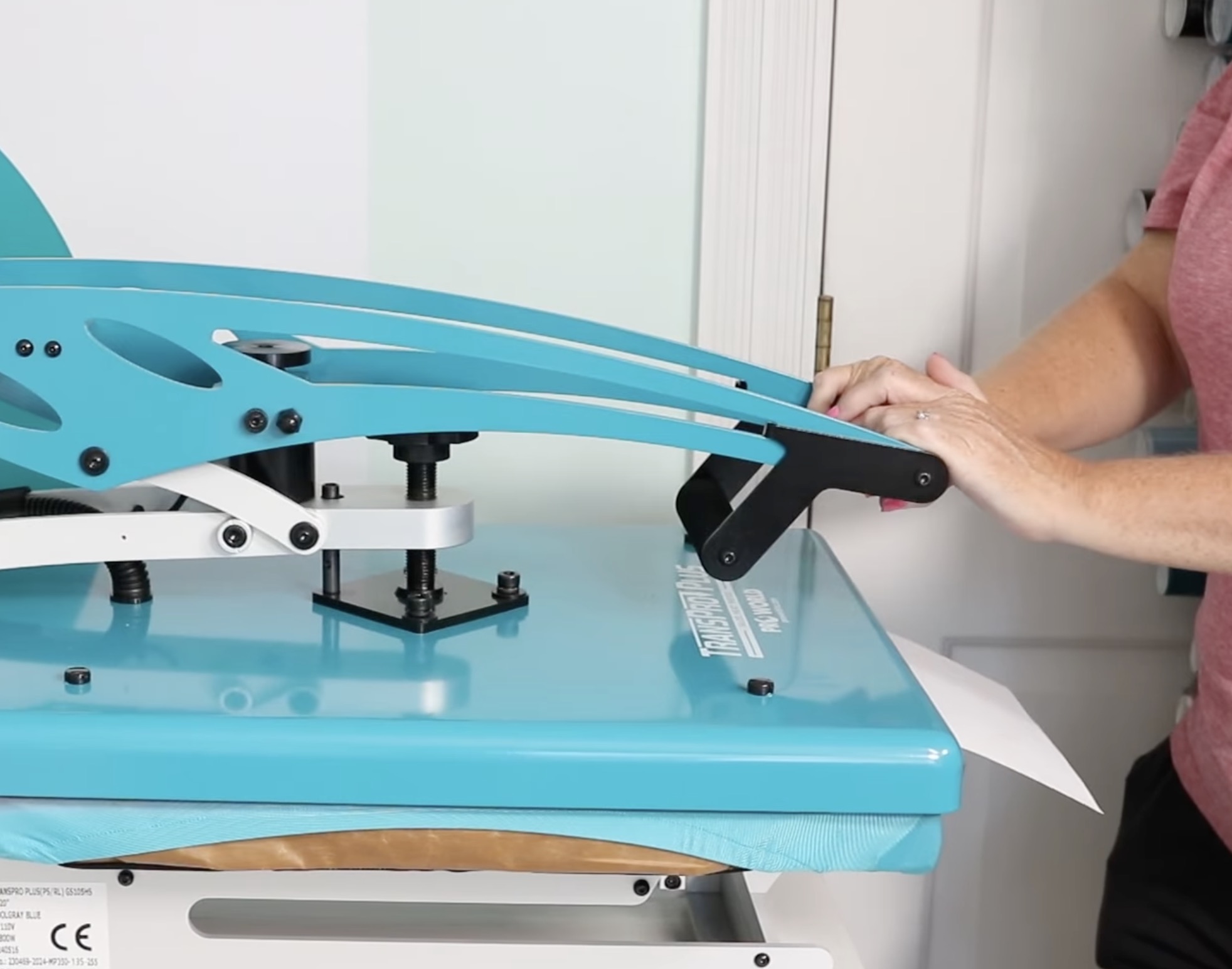 Close the press with paper hanging out halfway.