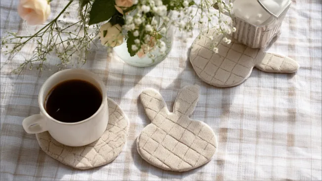 Easter bunny cup coasters made from beige fabric sewing