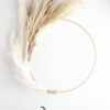 Pampas grass hoop wreath with mini pumpkins.